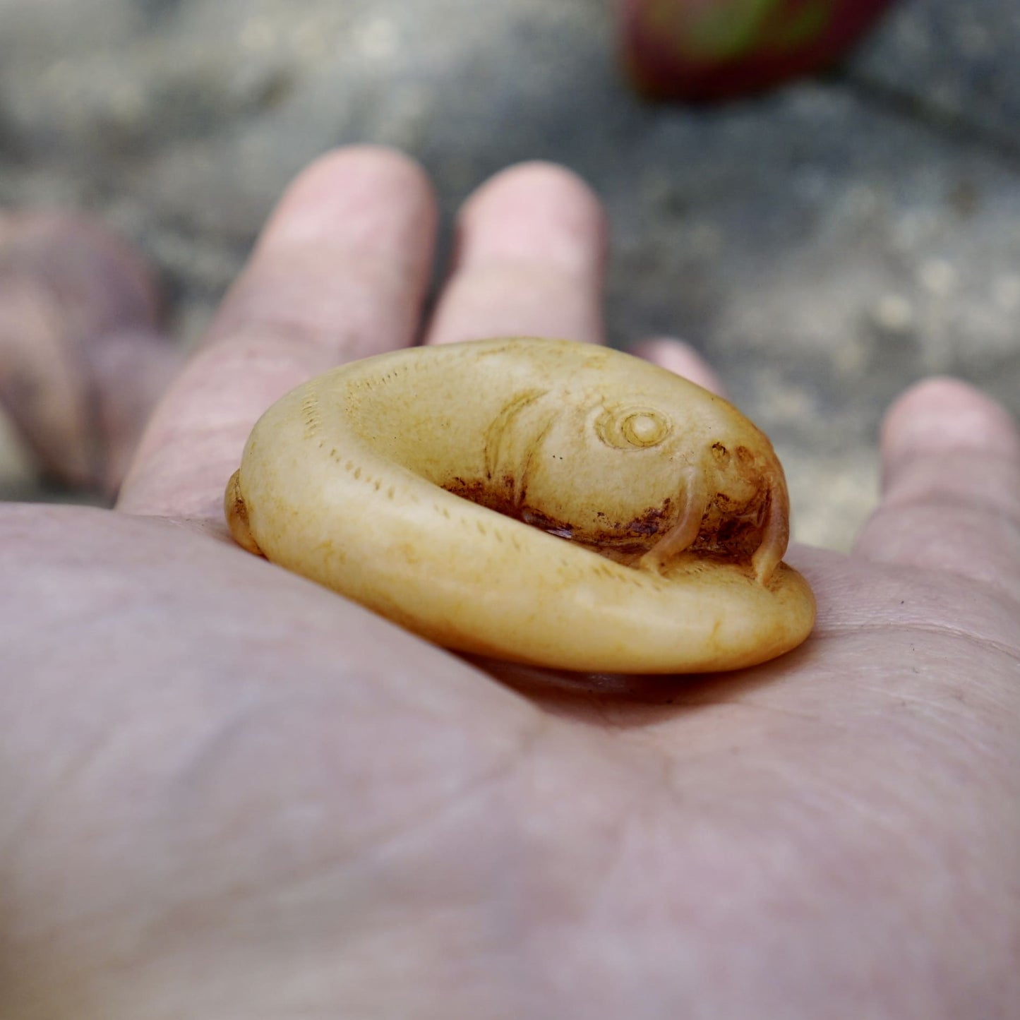 White jade catfish pendant with cinnabar stain