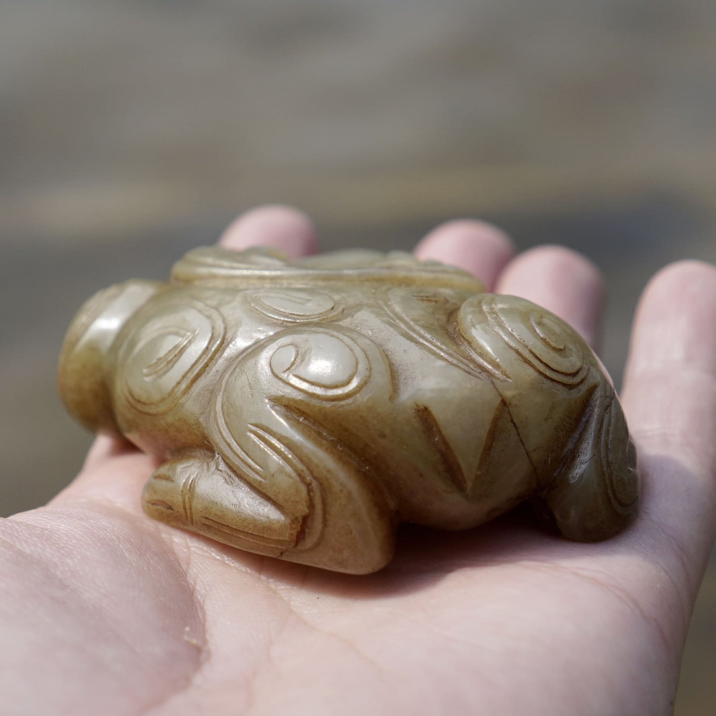 Round carved jade cow paperweight