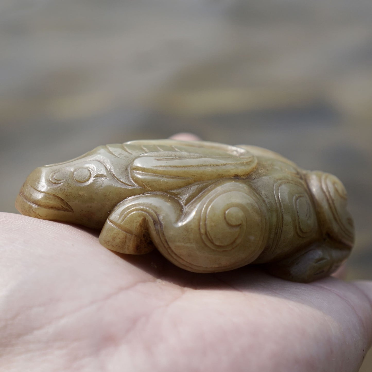 Round carved jade cow paperweight