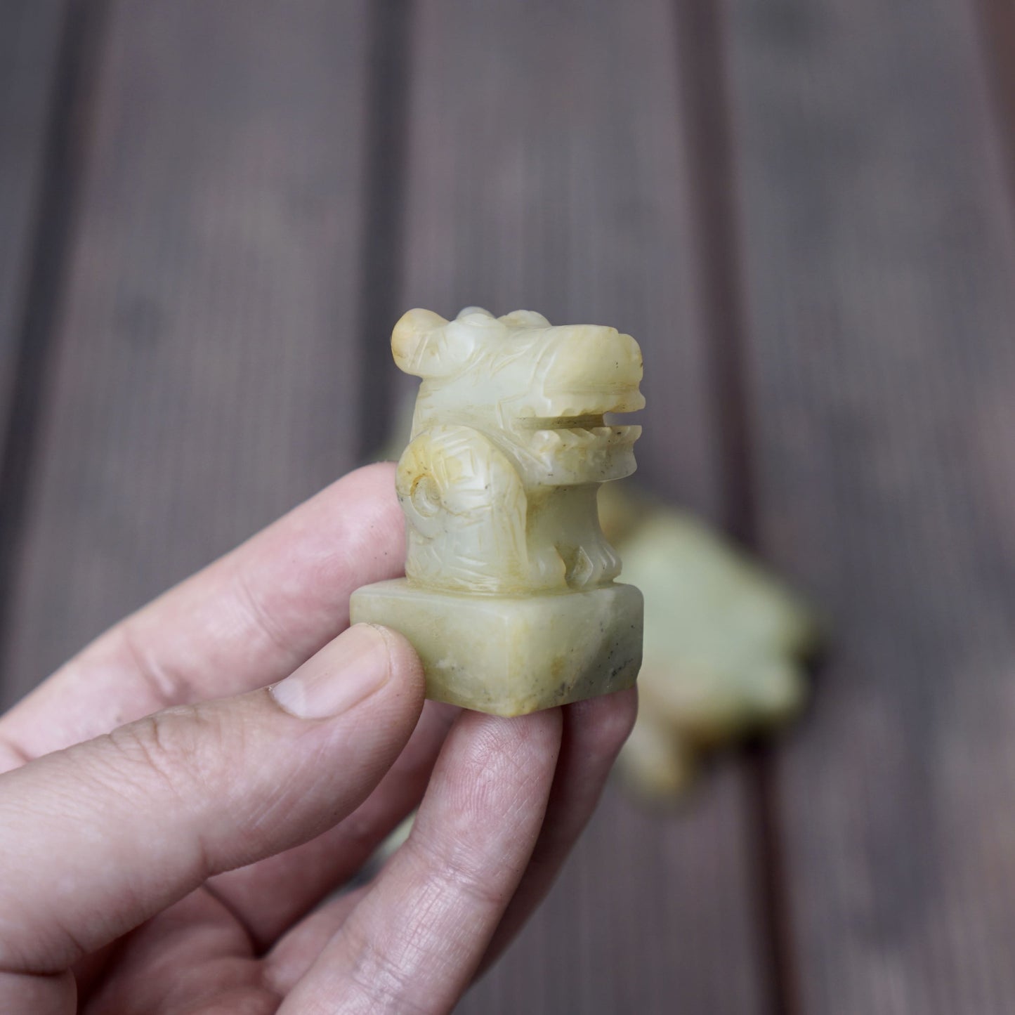 A set of jade seals with a bird carrying four sacred beasts