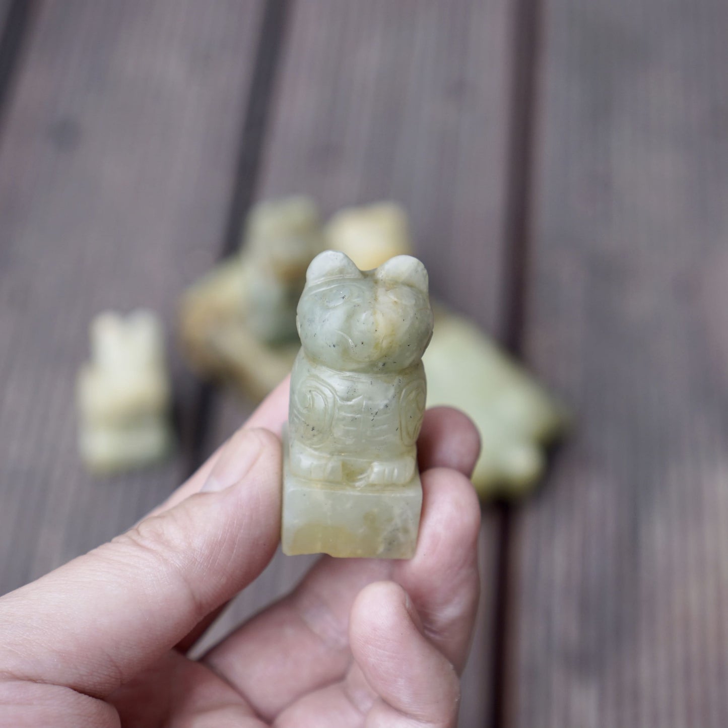 A set of jade seals with a bird carrying four sacred beasts