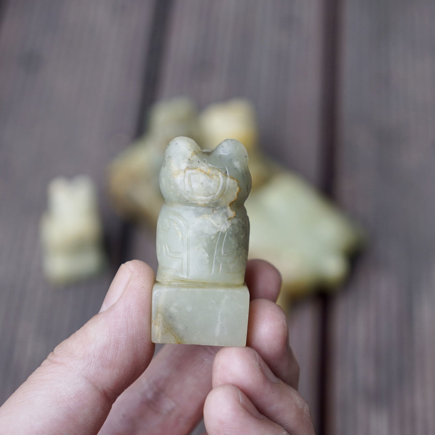 A set of jade seals with a bird carrying four sacred beasts