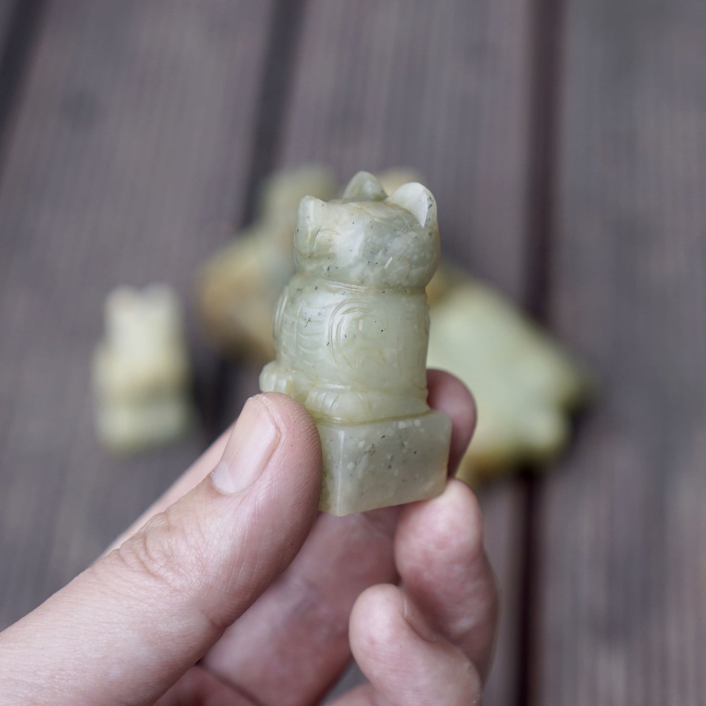 A set of jade seals with a bird carrying four sacred beasts