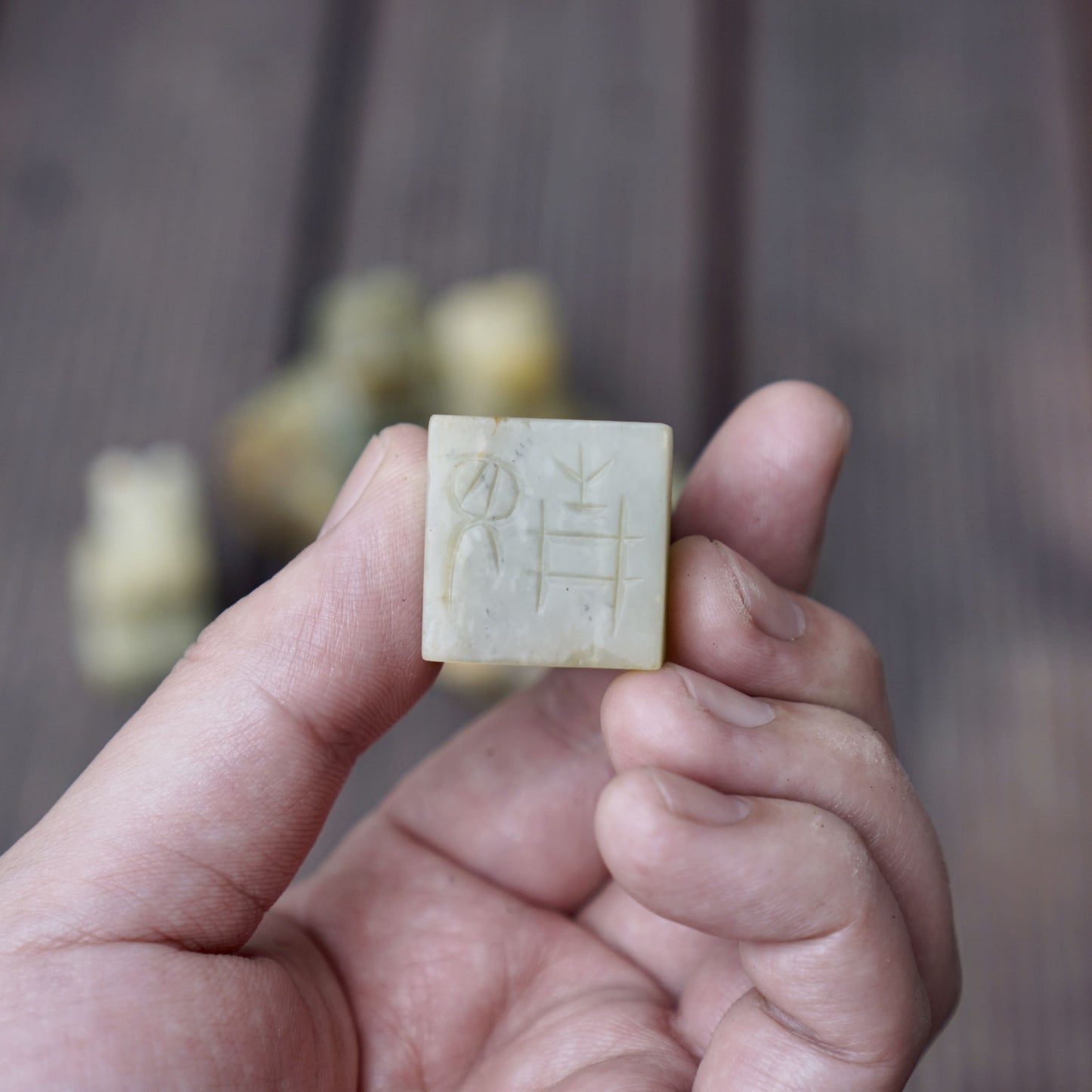 A set of jade seals with a bird carrying four sacred beasts