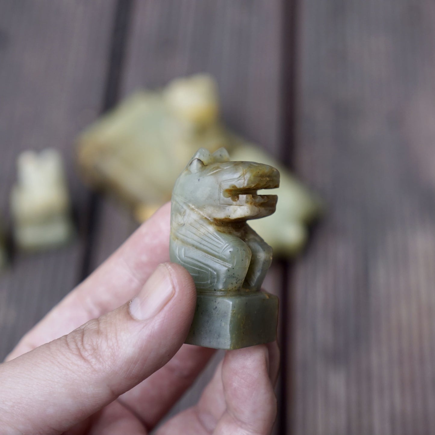 A set of jade seals with a bird carrying four sacred beasts