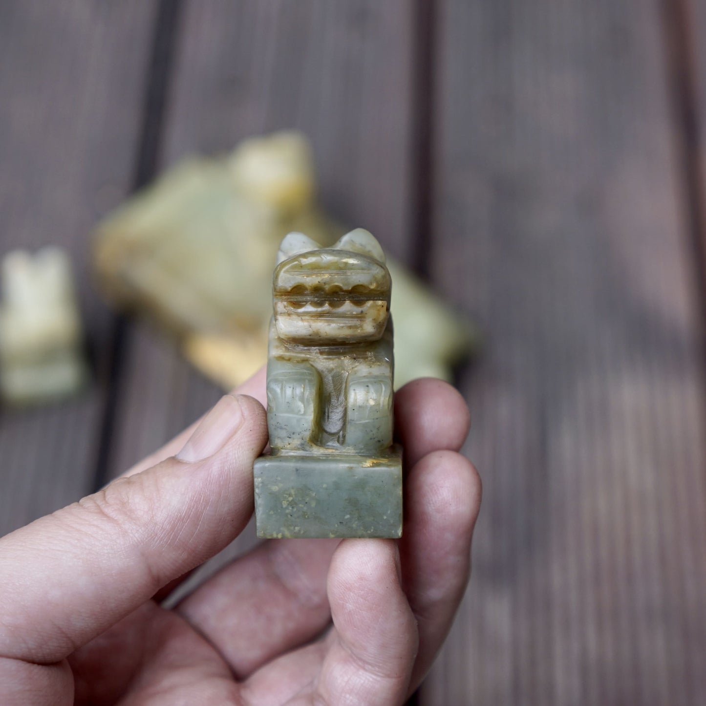 A set of jade seals with a bird carrying four sacred beasts