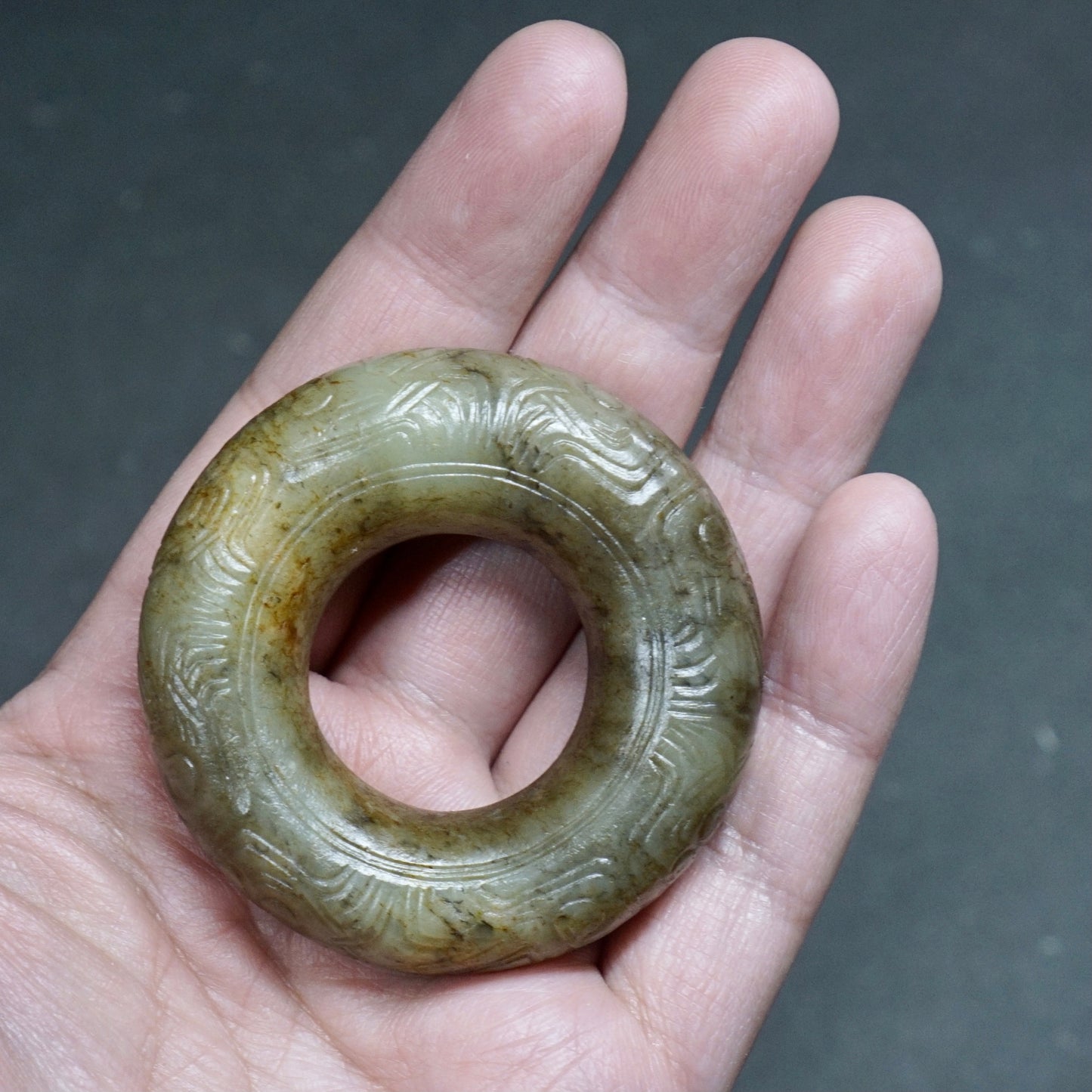 Jade ring with human face pattern