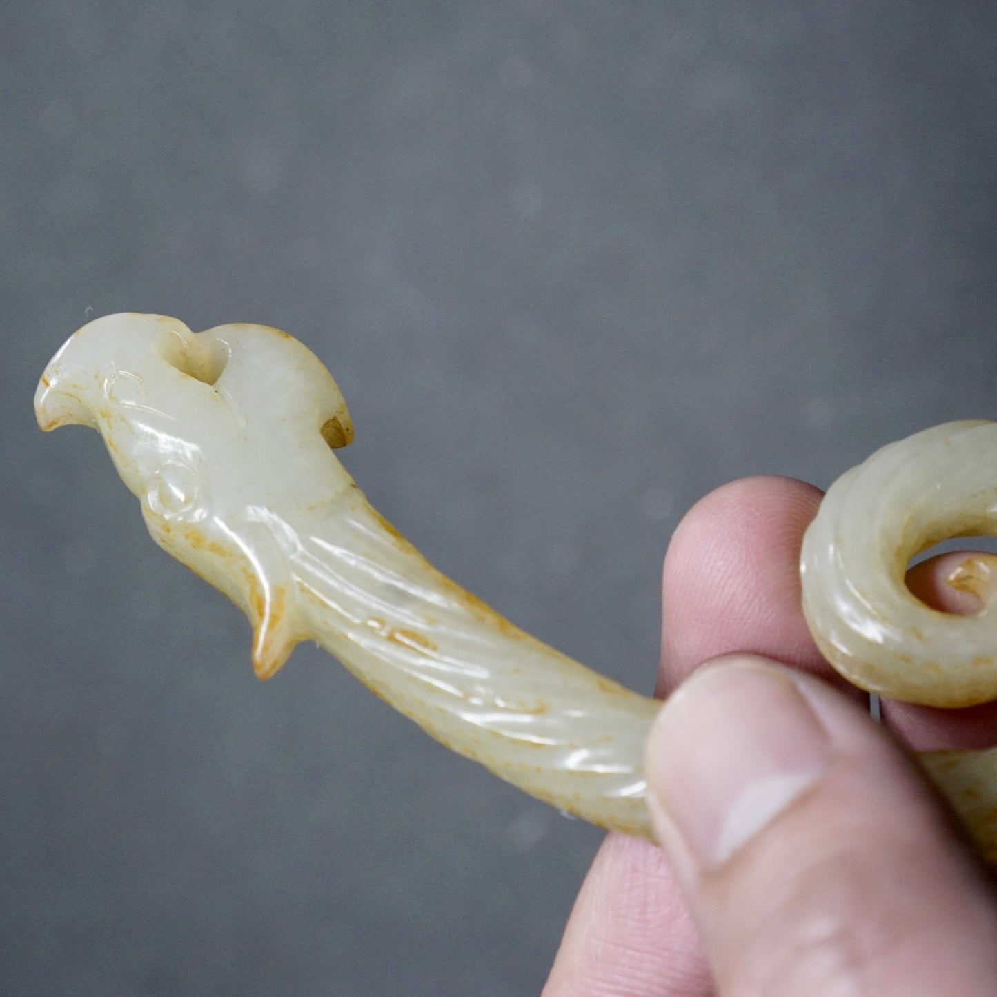 Twisted white jade hook-shaped dragon pendant