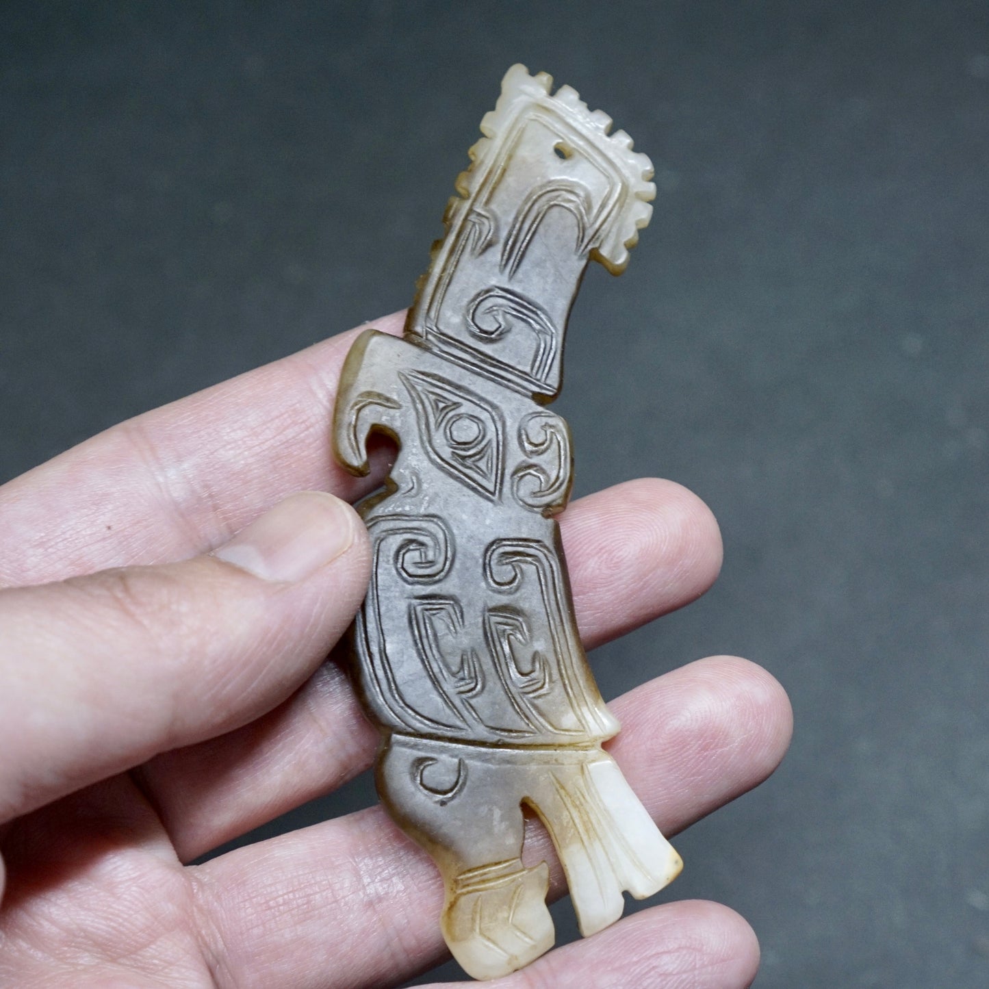 White jade pendant in the shape of a high-crowned parrot