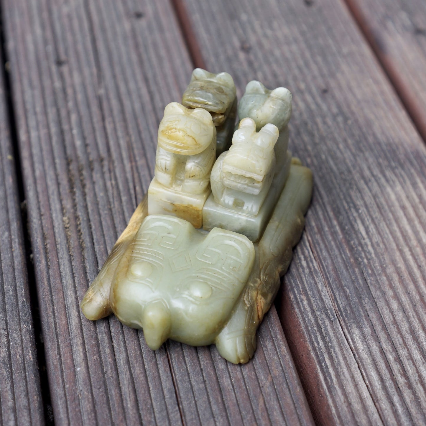 A set of jade seals with a bird carrying four sacred beasts