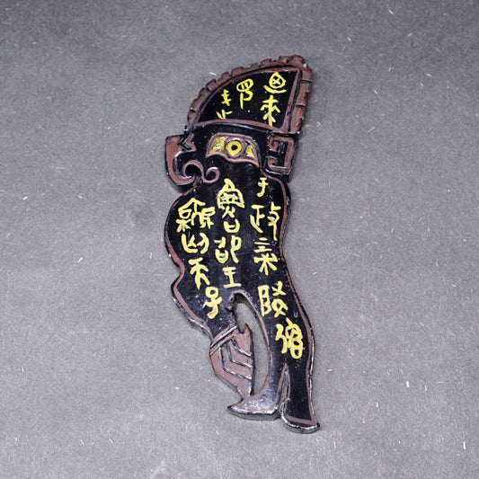 A double-sided lacquer-painted jade parrot pendant with inscriptions