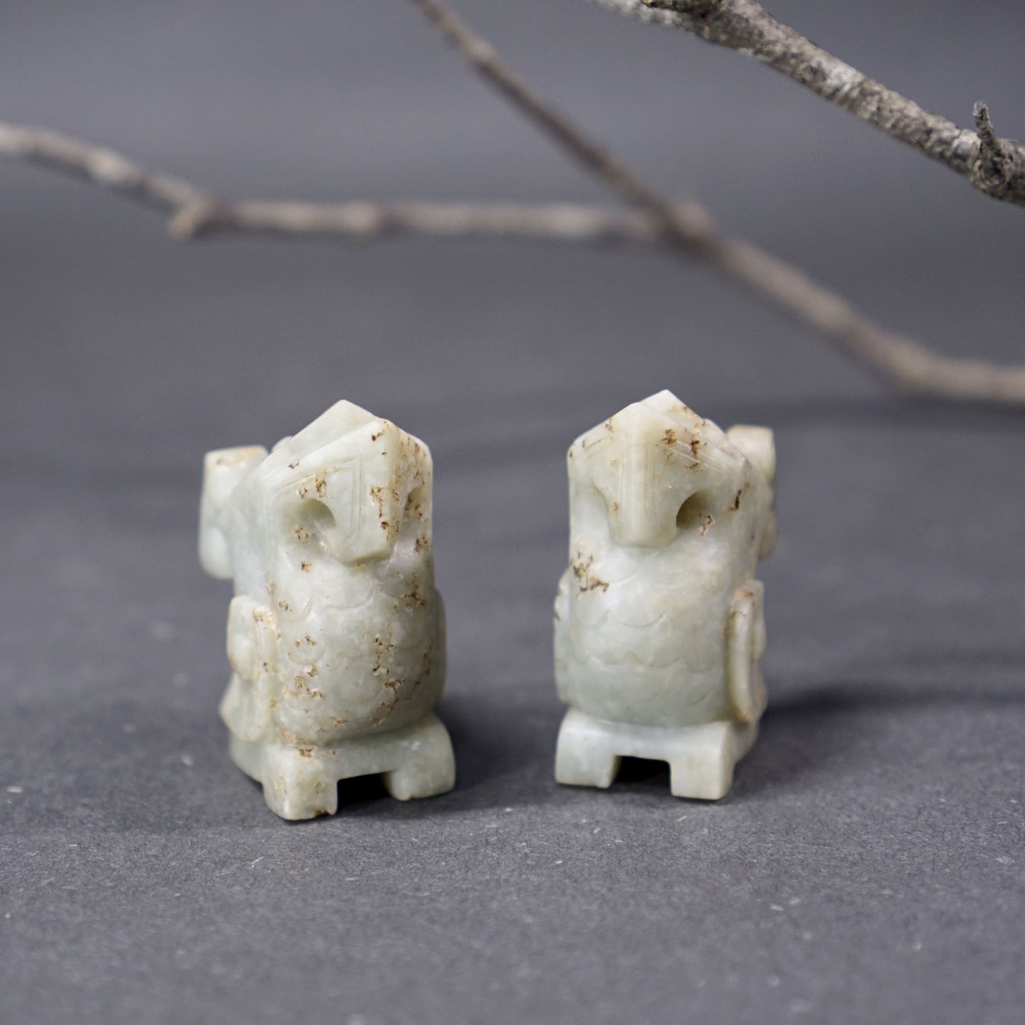 A pair of jade owls carved in the round