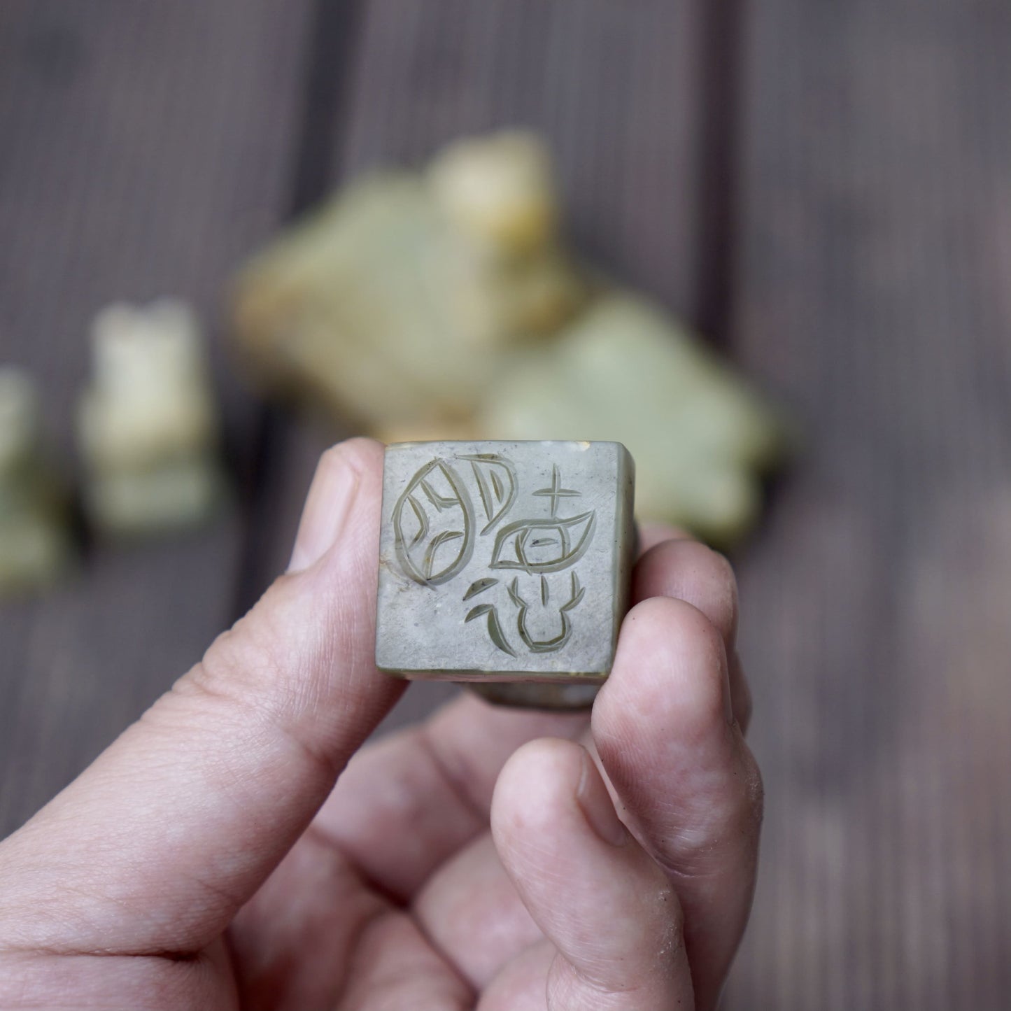 A set of jade seals with a bird carrying four sacred beasts