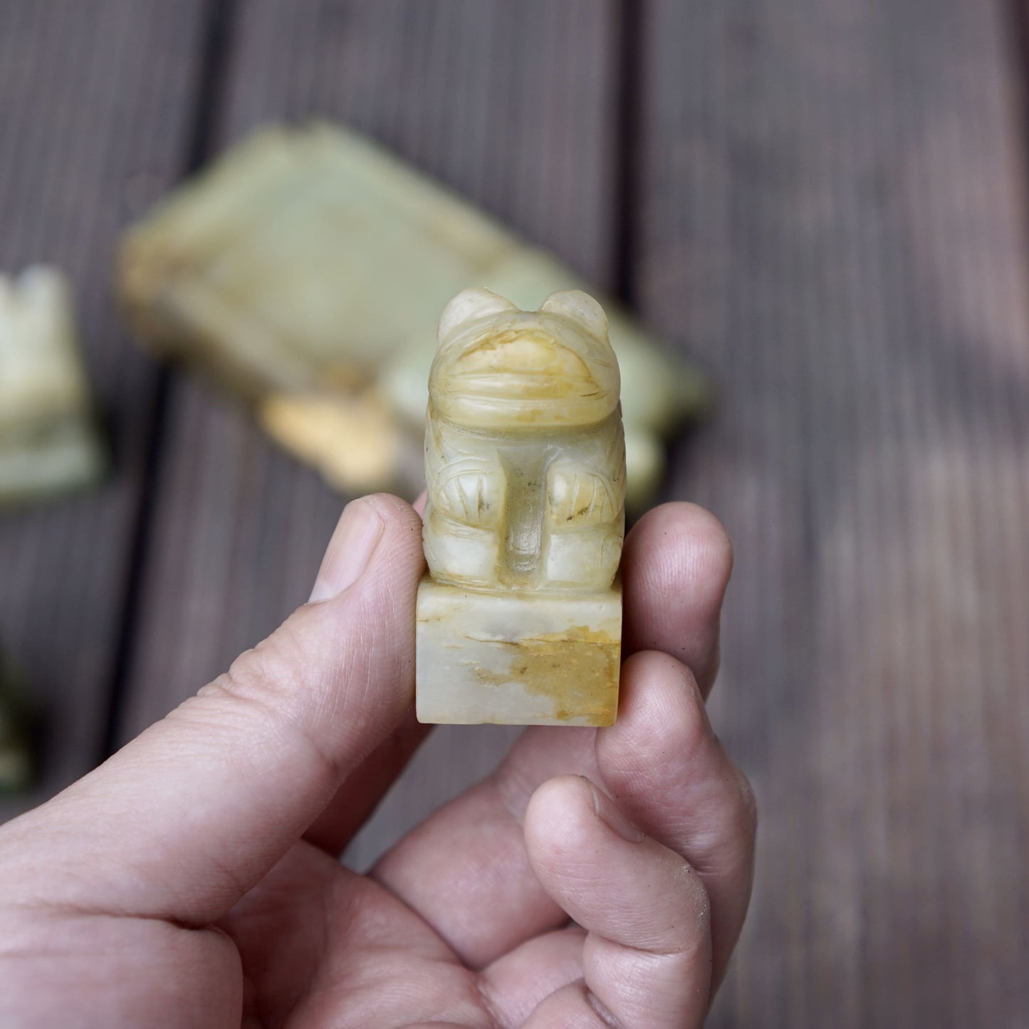 A set of jade seals with a bird carrying four sacred beasts