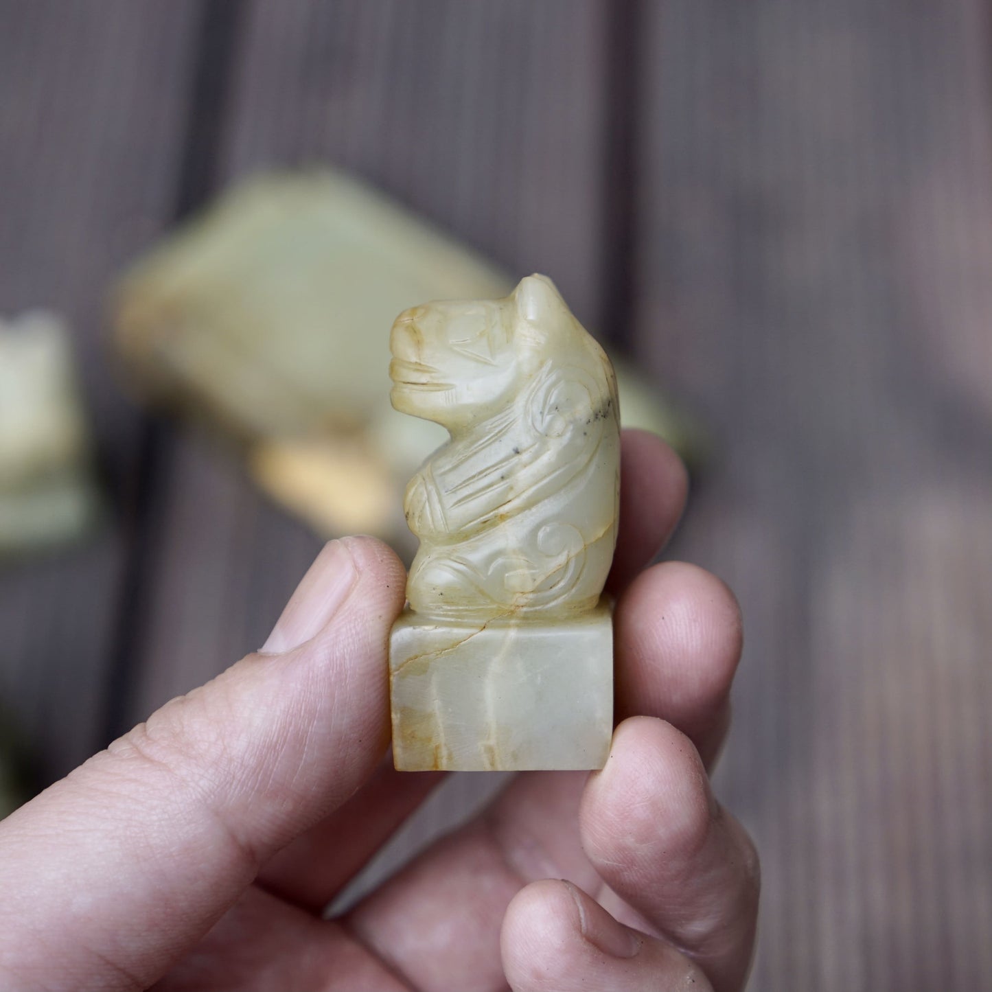 A set of jade seals with a bird carrying four sacred beasts