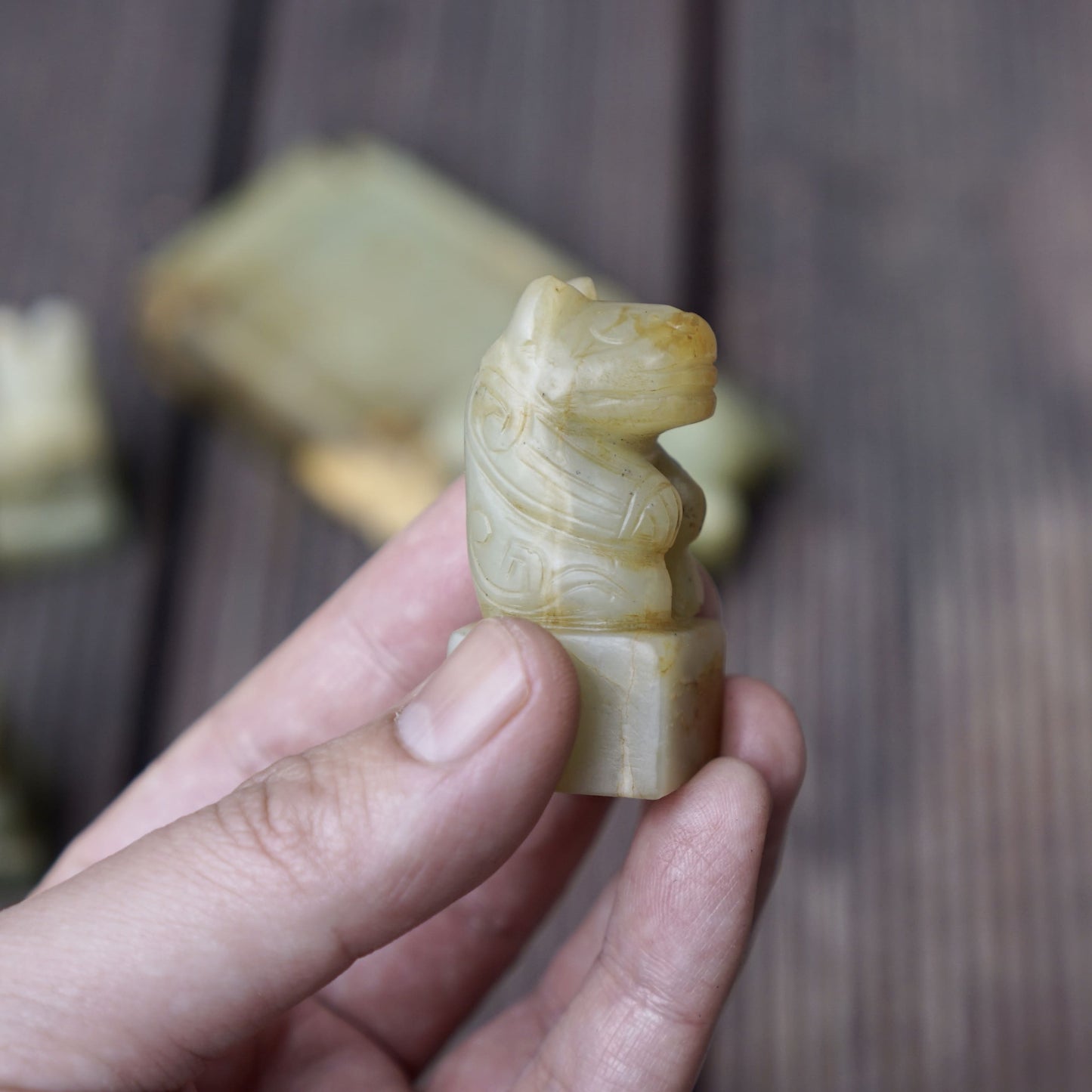 A set of jade seals with a bird carrying four sacred beasts