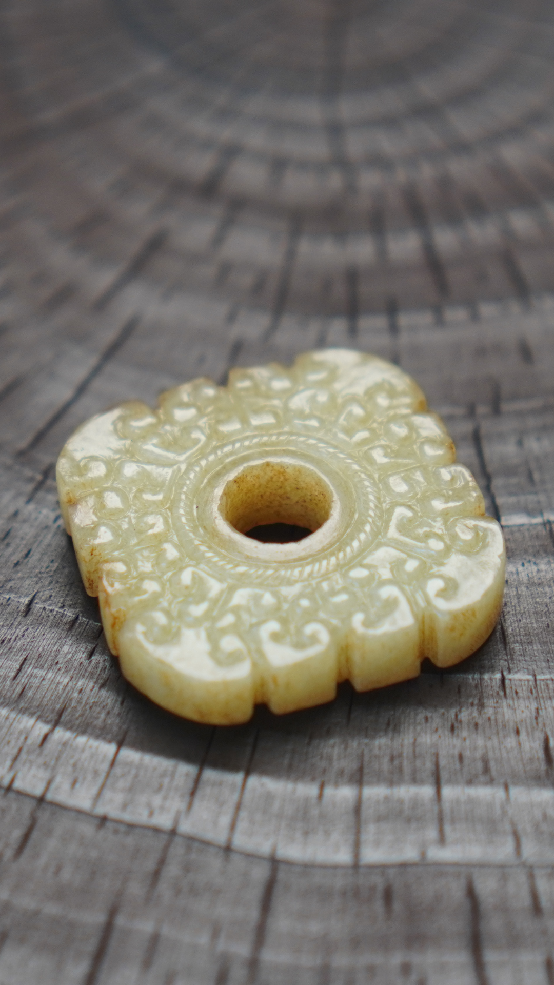 Warring States and Han Dynasty style white jade double-sided square pendant with intricate cloud pattern.