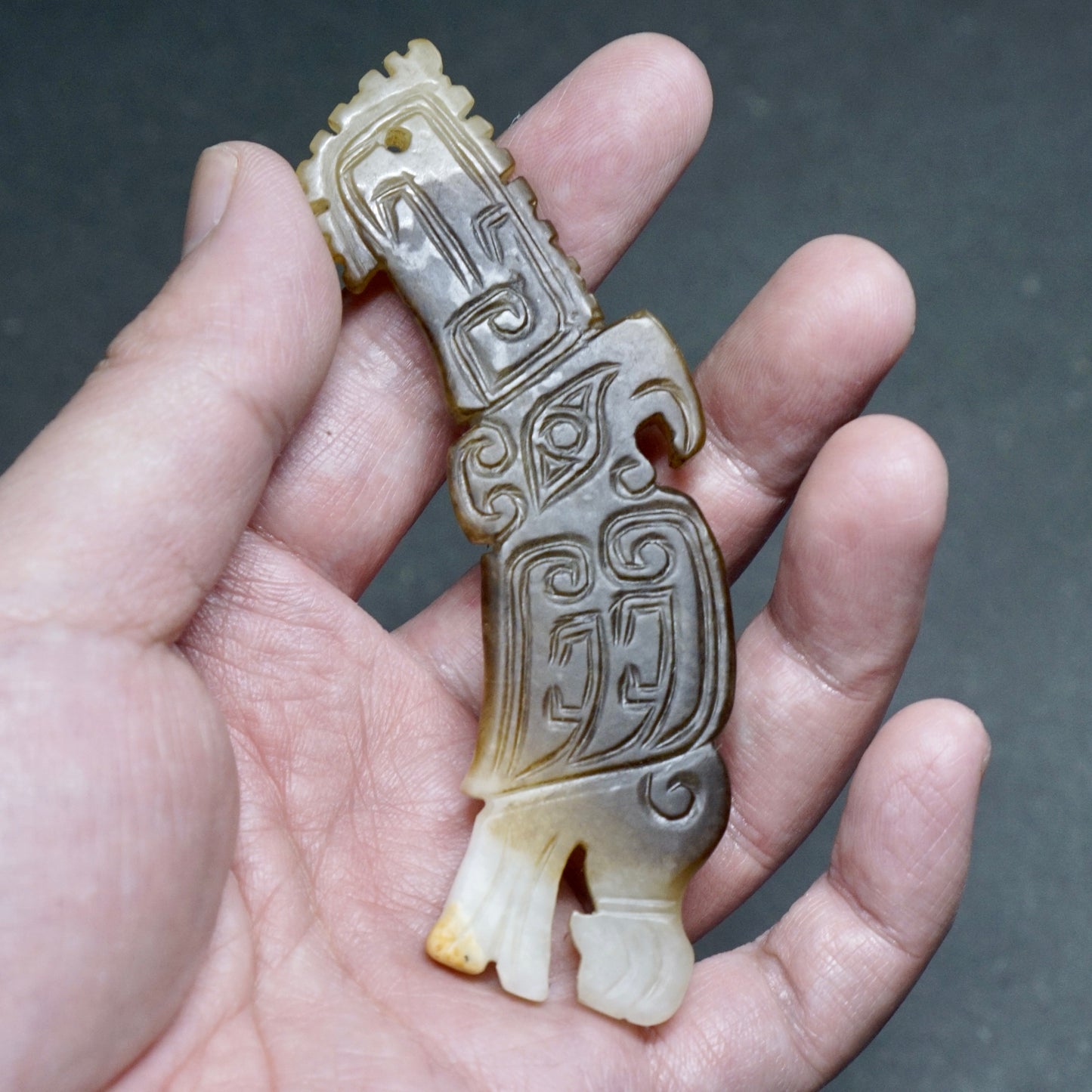 White jade pendant in the shape of a high-crowned parrot