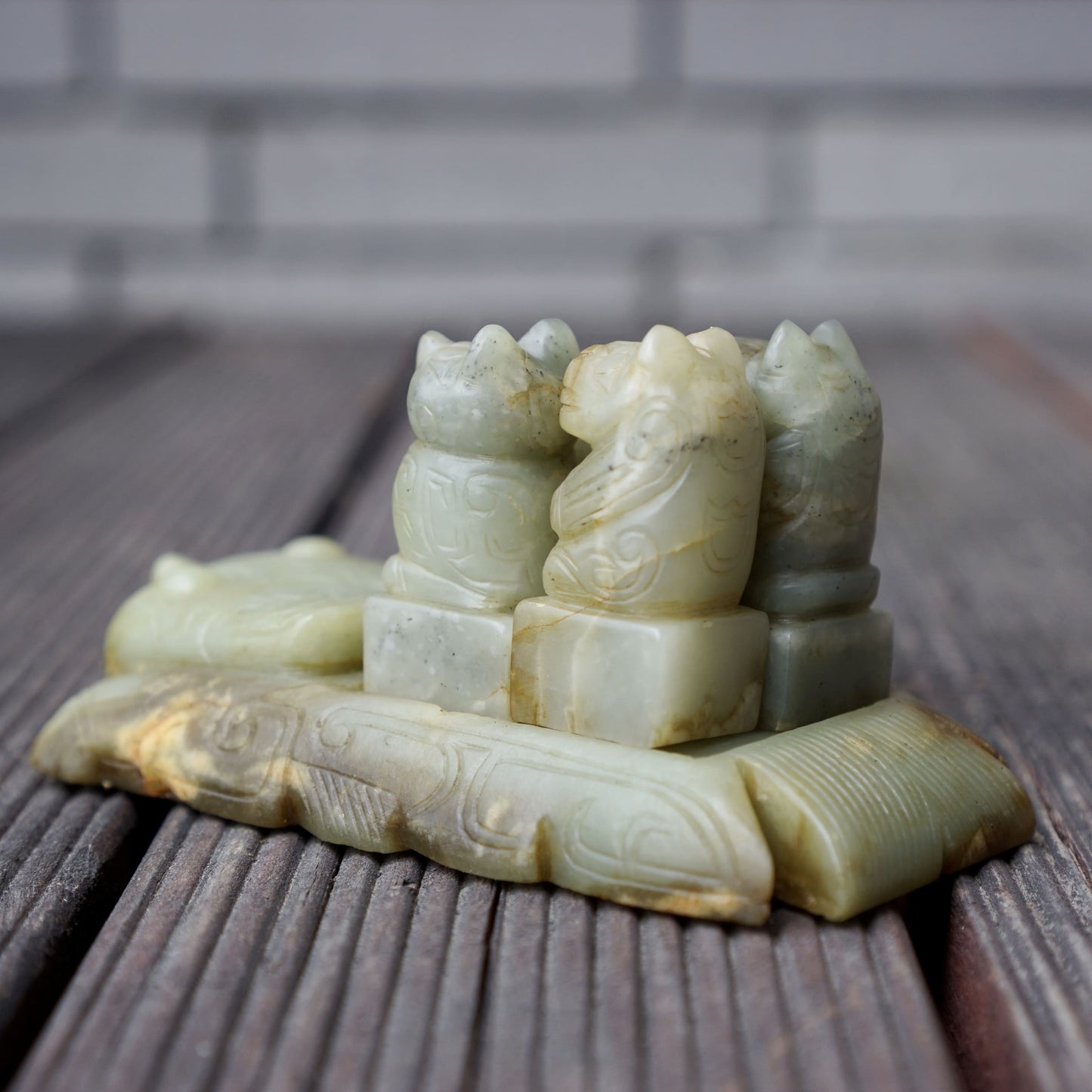 A set of jade seals with a bird carrying four sacred beasts