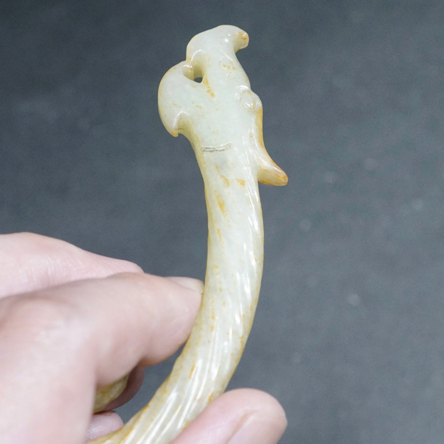 Twisted white jade hook-shaped dragon pendant