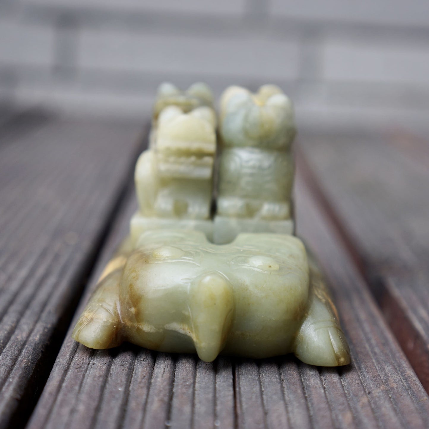 A set of jade seals with a bird carrying four sacred beasts