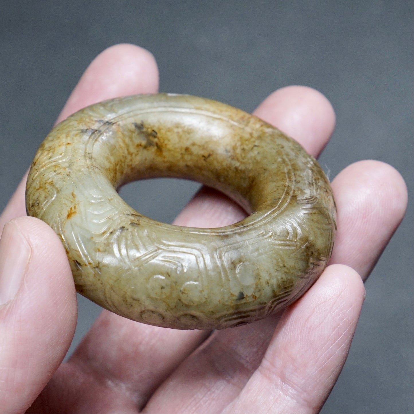 Jade ring with human face pattern