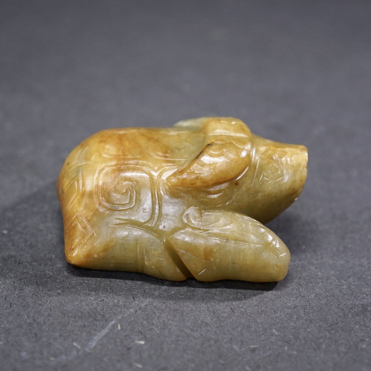 Jade lying bull with inscription