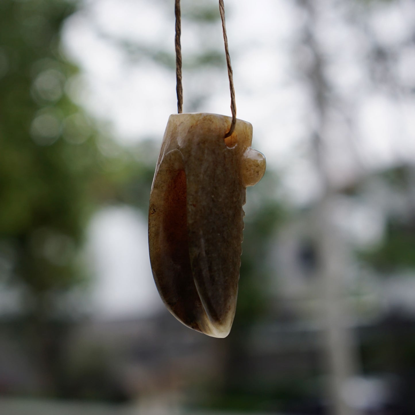 Tubular round sculpture of a jade cicada with convex eyes