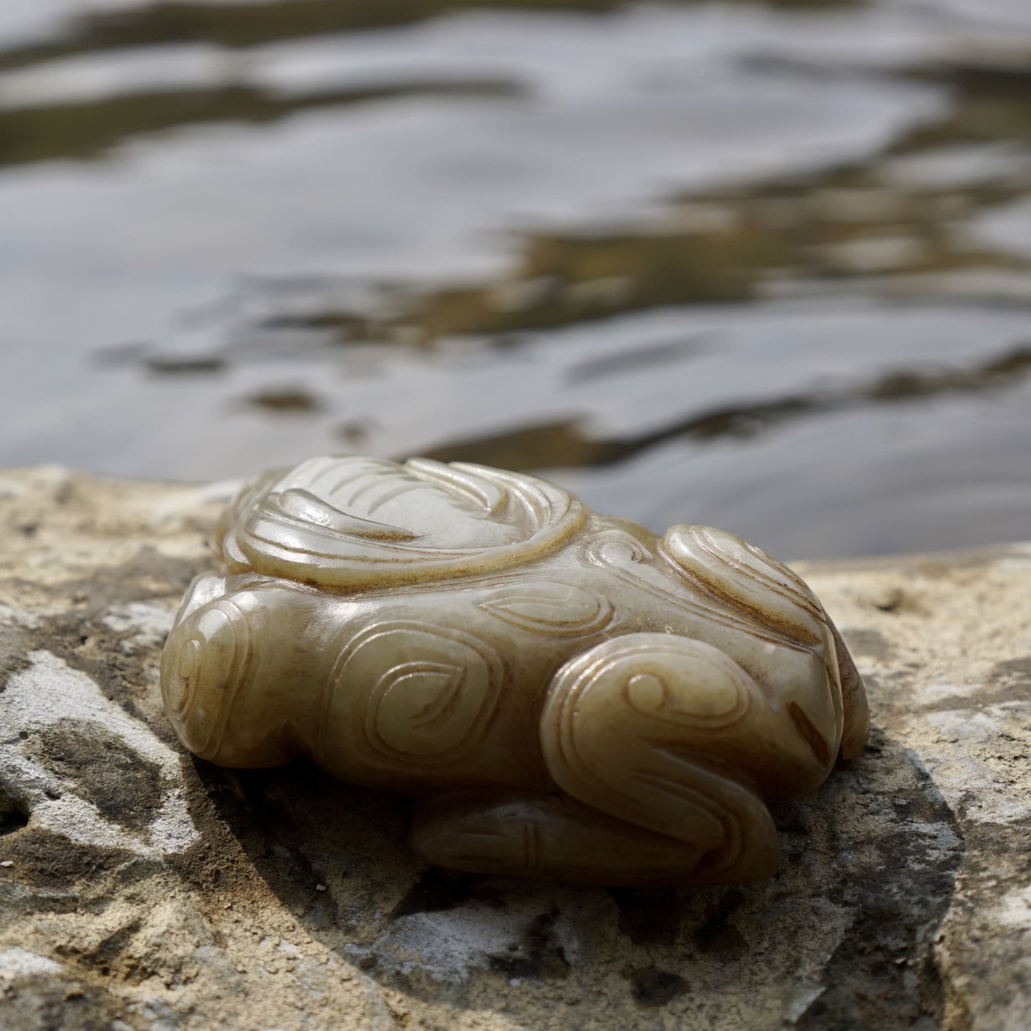 Round carved jade cow paperweight