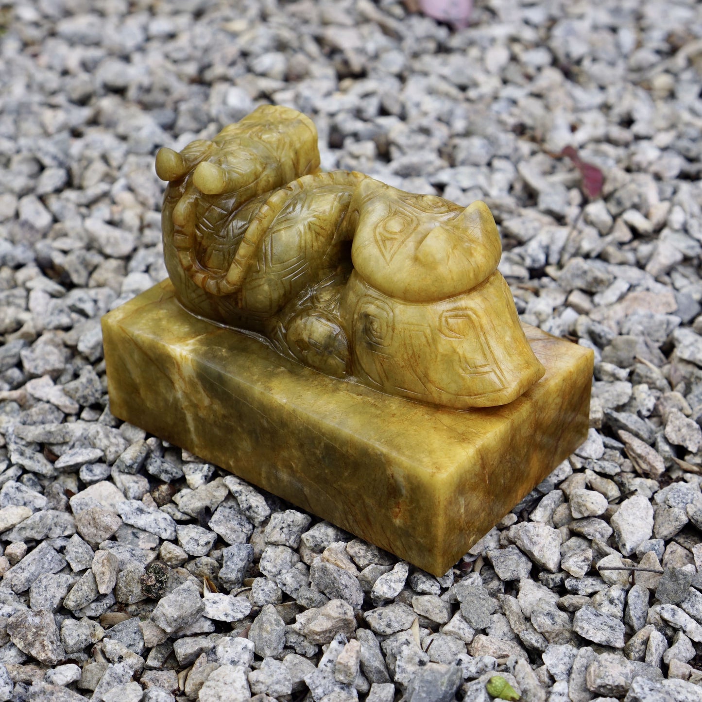 A jade seal with round-carved owl and dragon