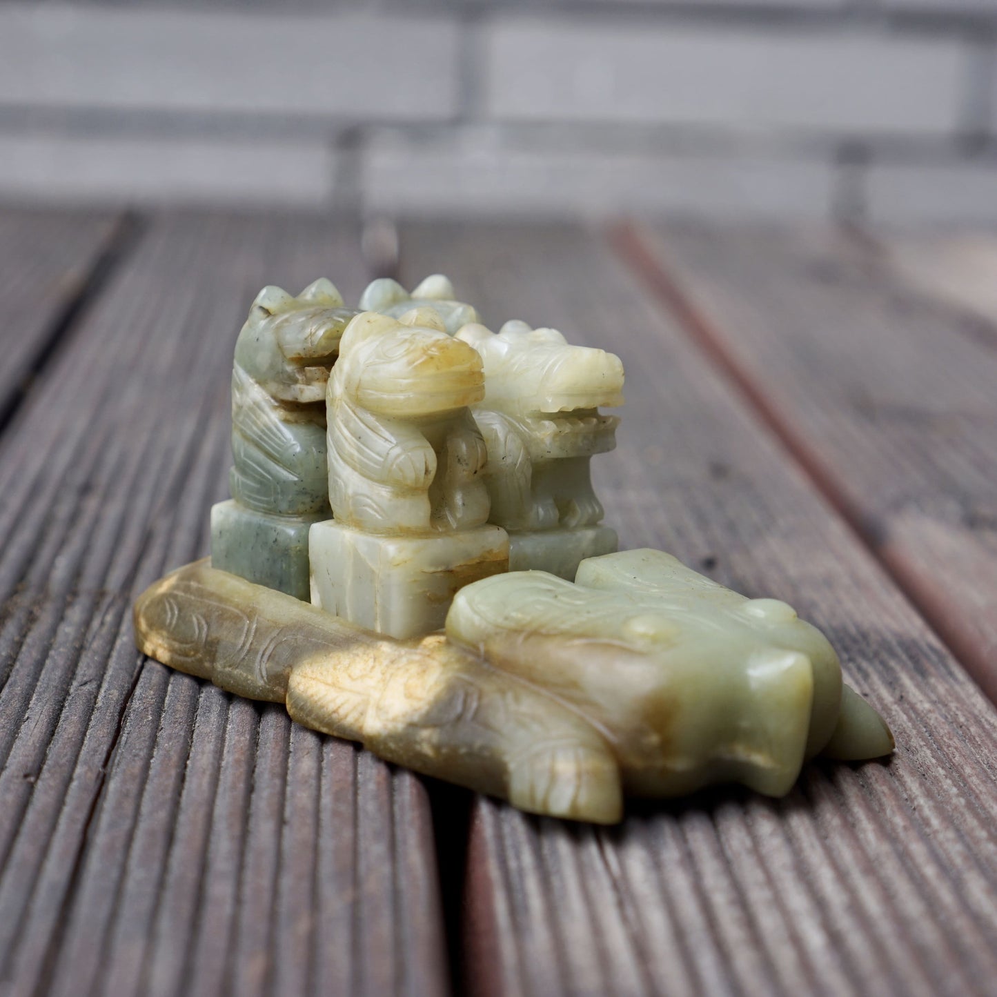 A set of jade seals with a bird carrying four sacred beasts