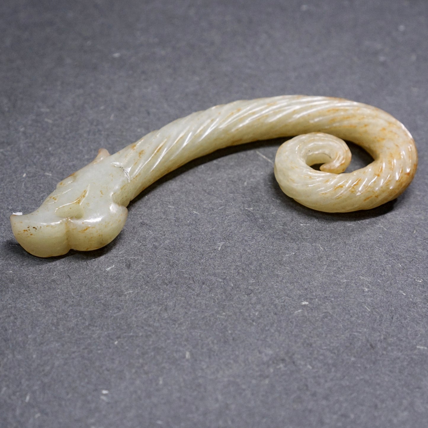 Twisted white jade hook-shaped dragon pendant