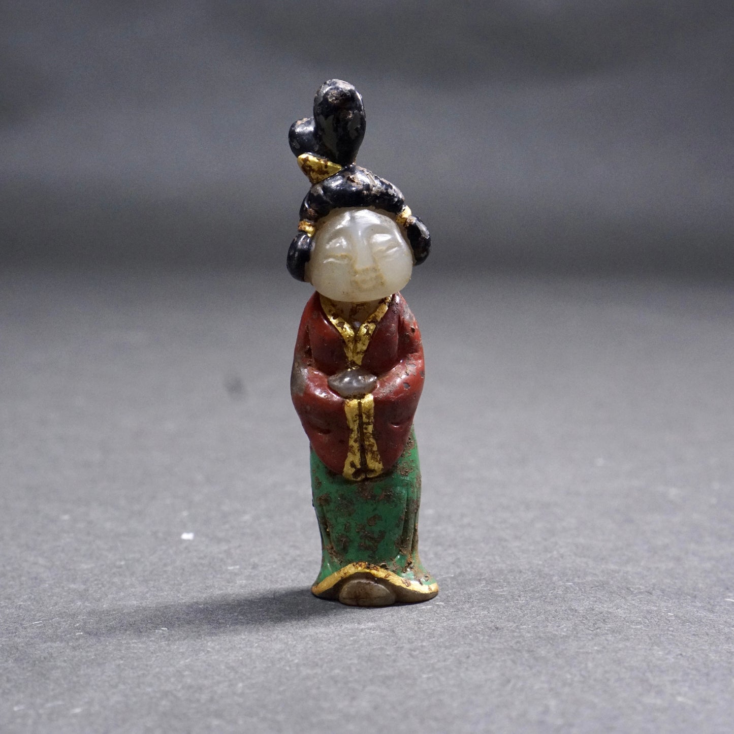 A Tang Dynasty Gilded and Painted Hetian White Jade Lady