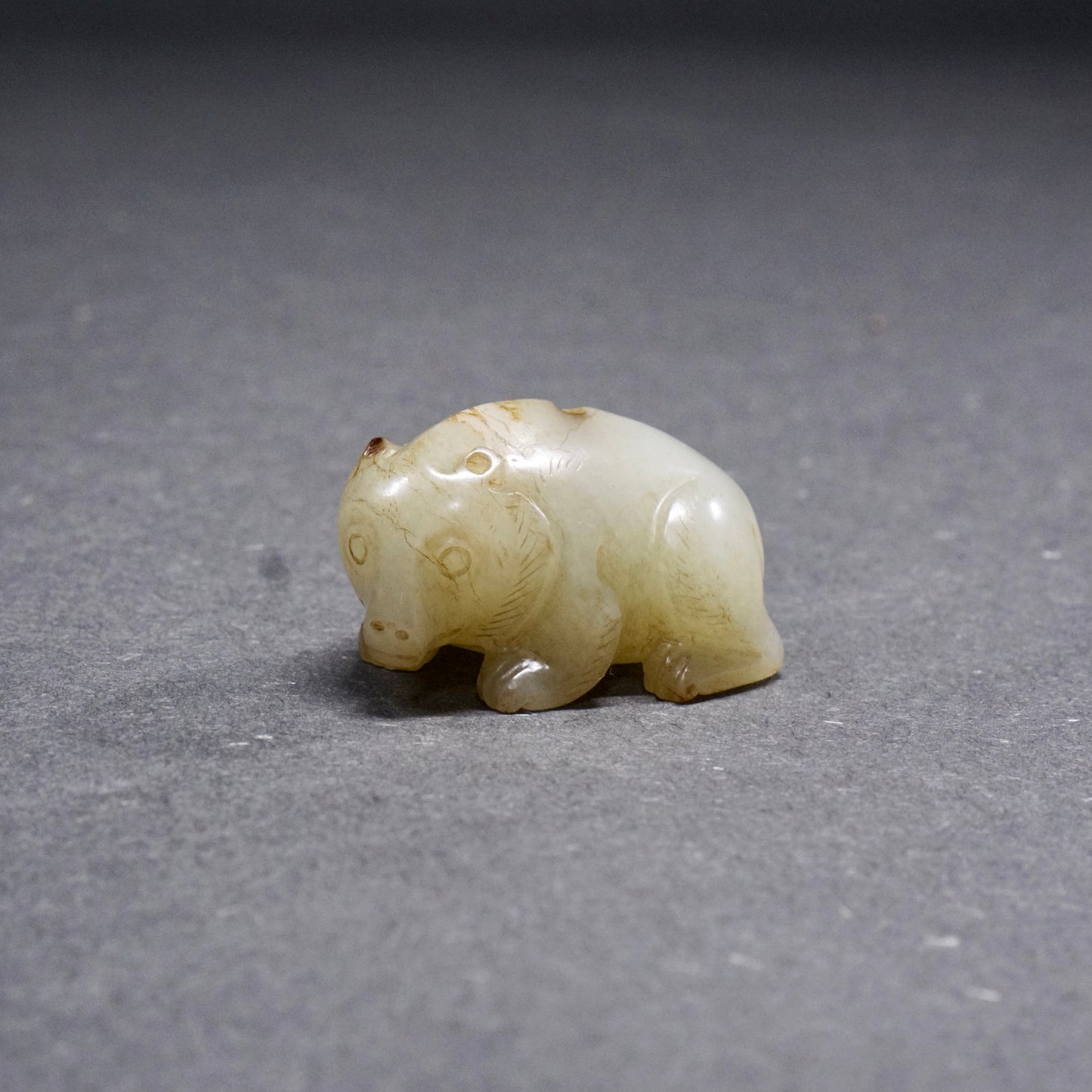 Han pair of pierced fine white jade bear