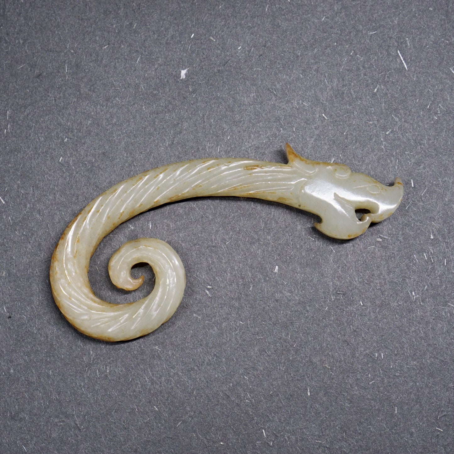 Twisted white jade hook-shaped dragon pendant