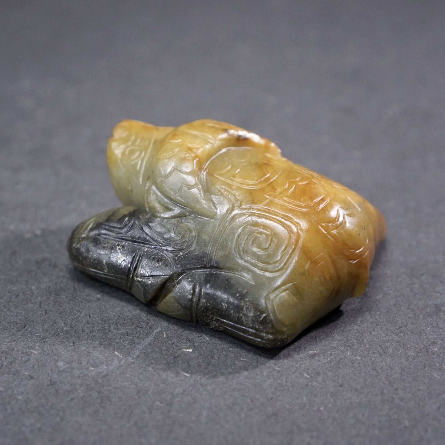 Jade lying bull with inscription