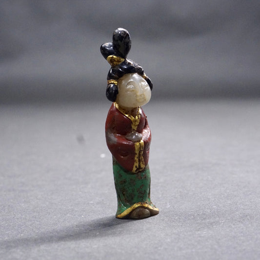 A Tang Dynasty Gilded and Painted Hetian White Jade Lady