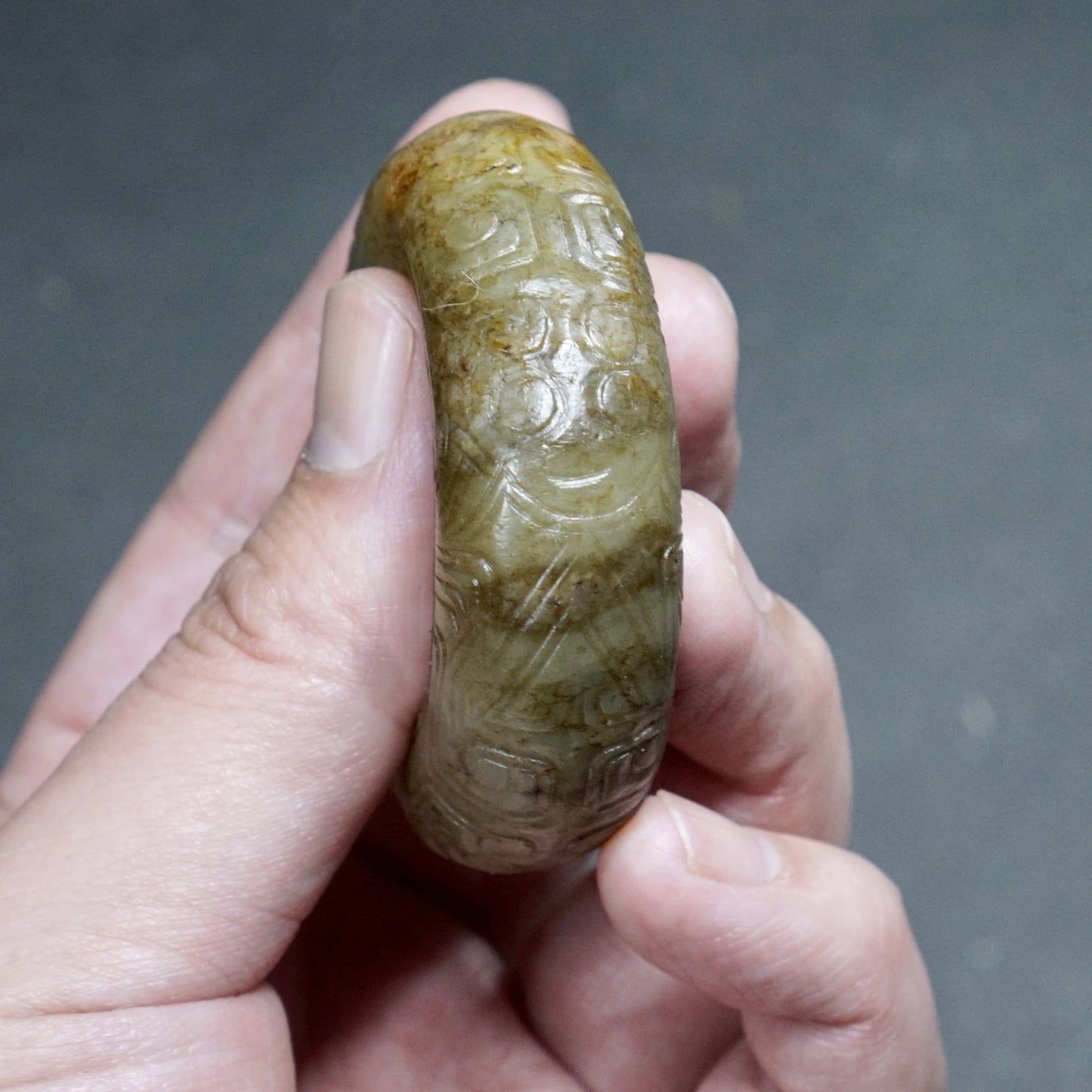 Jade ring with human face pattern