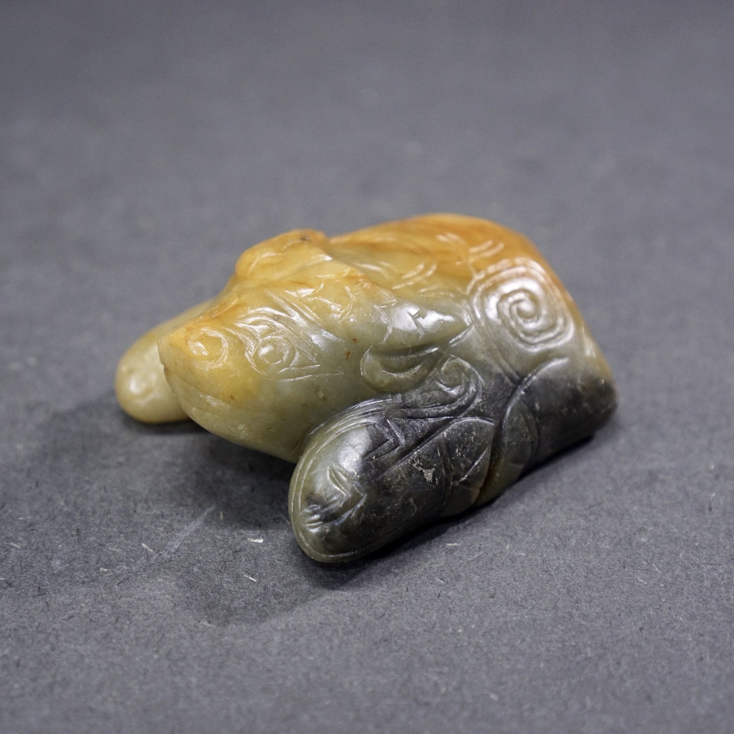 Jade lying bull with inscription