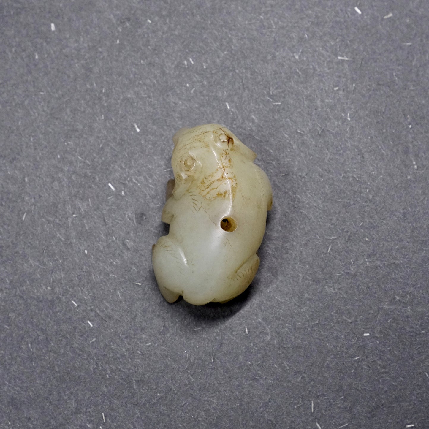 Han pair of pierced fine white jade bear