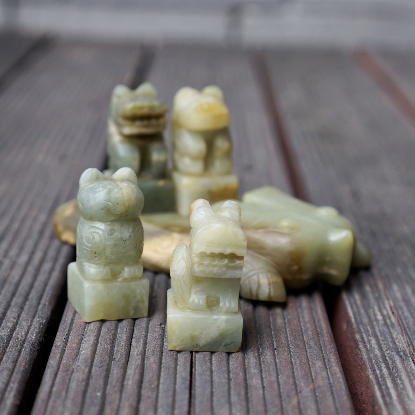 A set of jade seals with a bird carrying four sacred beasts