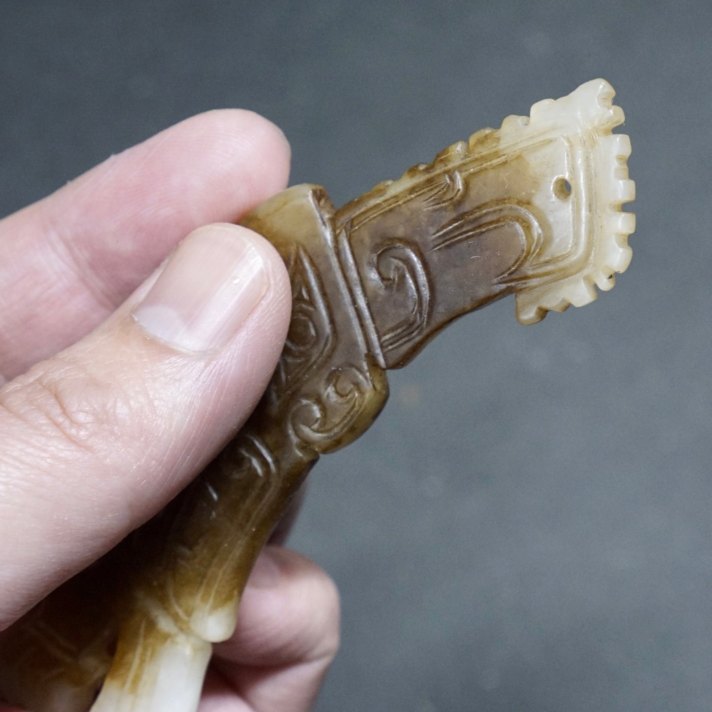 White jade pendant in the shape of a high-crowned parrot