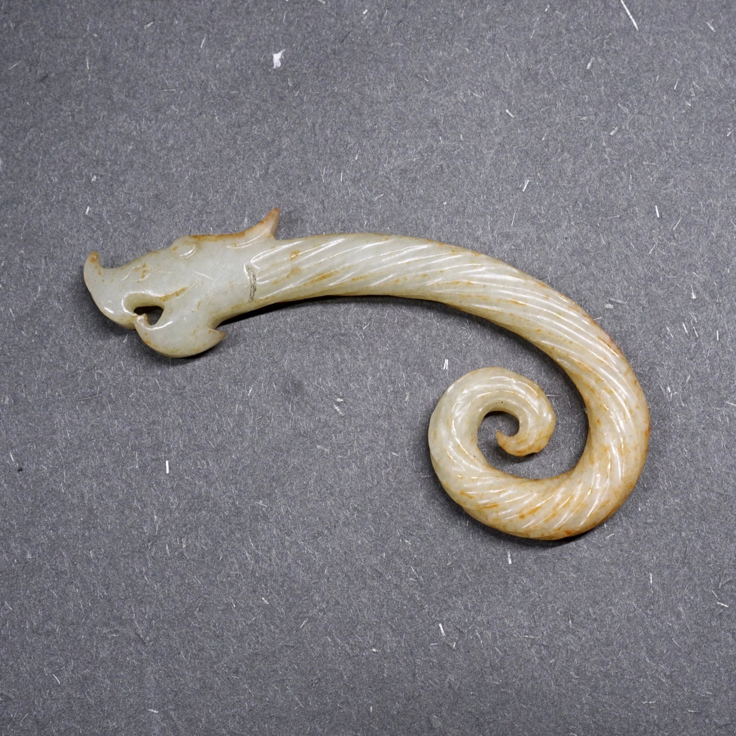 Twisted white jade hook-shaped dragon pendant