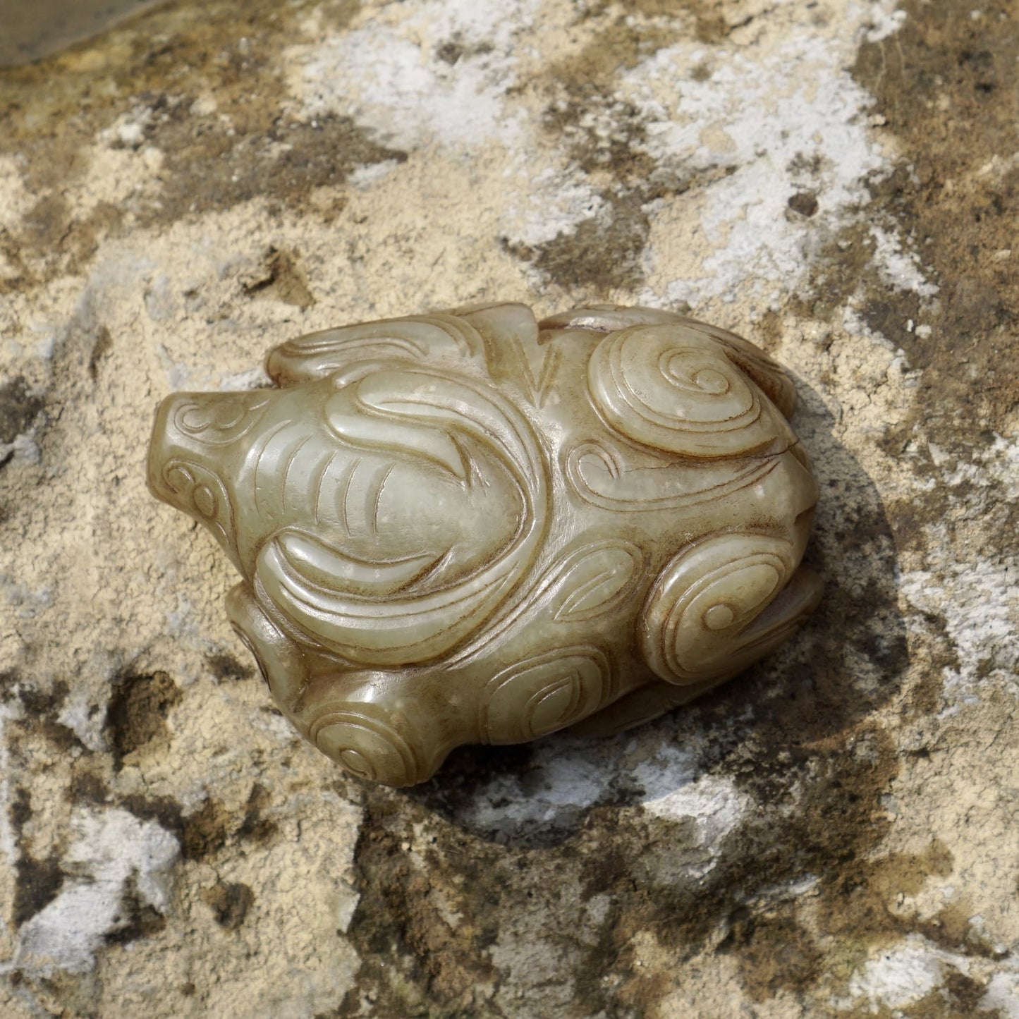 Round carved jade cow paperweight