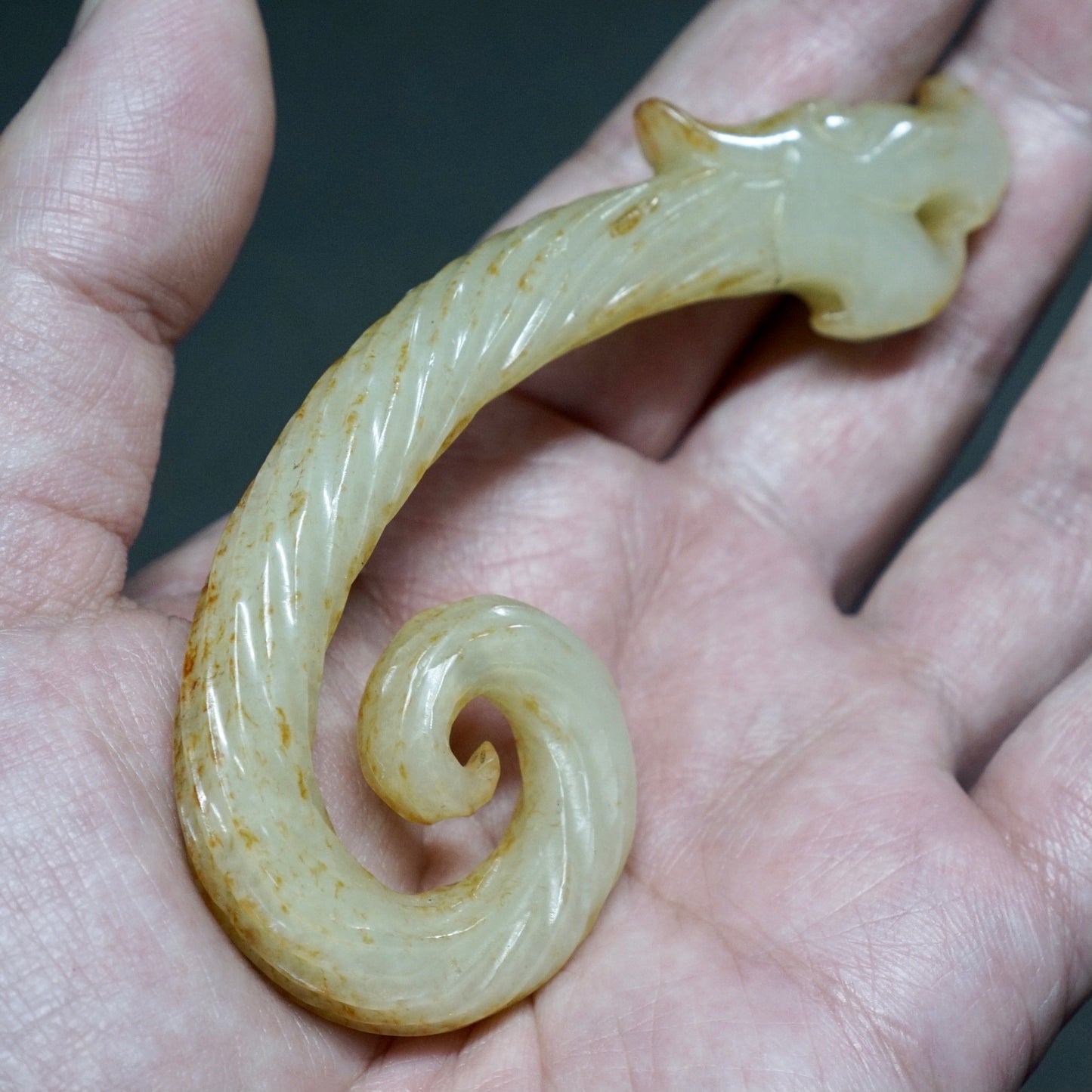 Twisted white jade hook-shaped dragon pendant