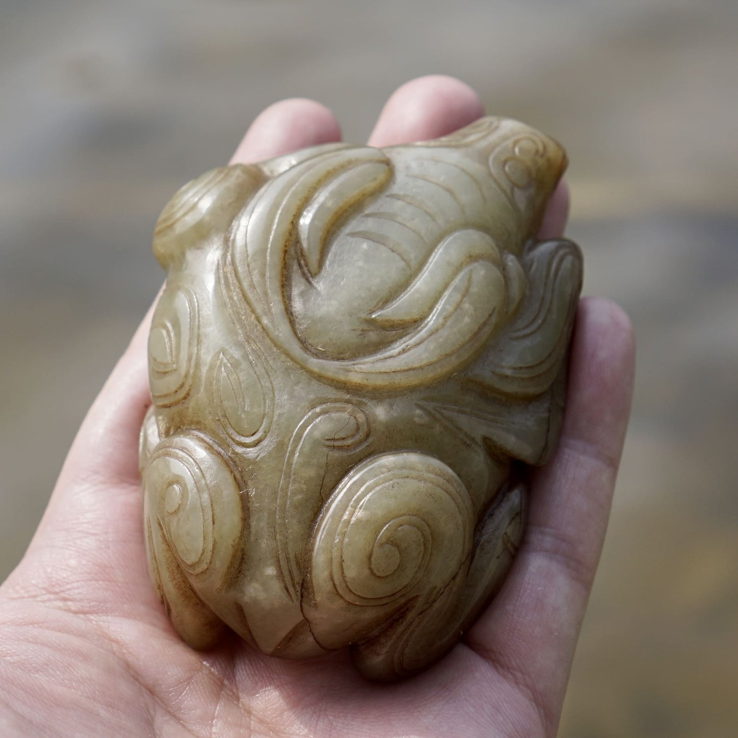 Round carved jade cow paperweight