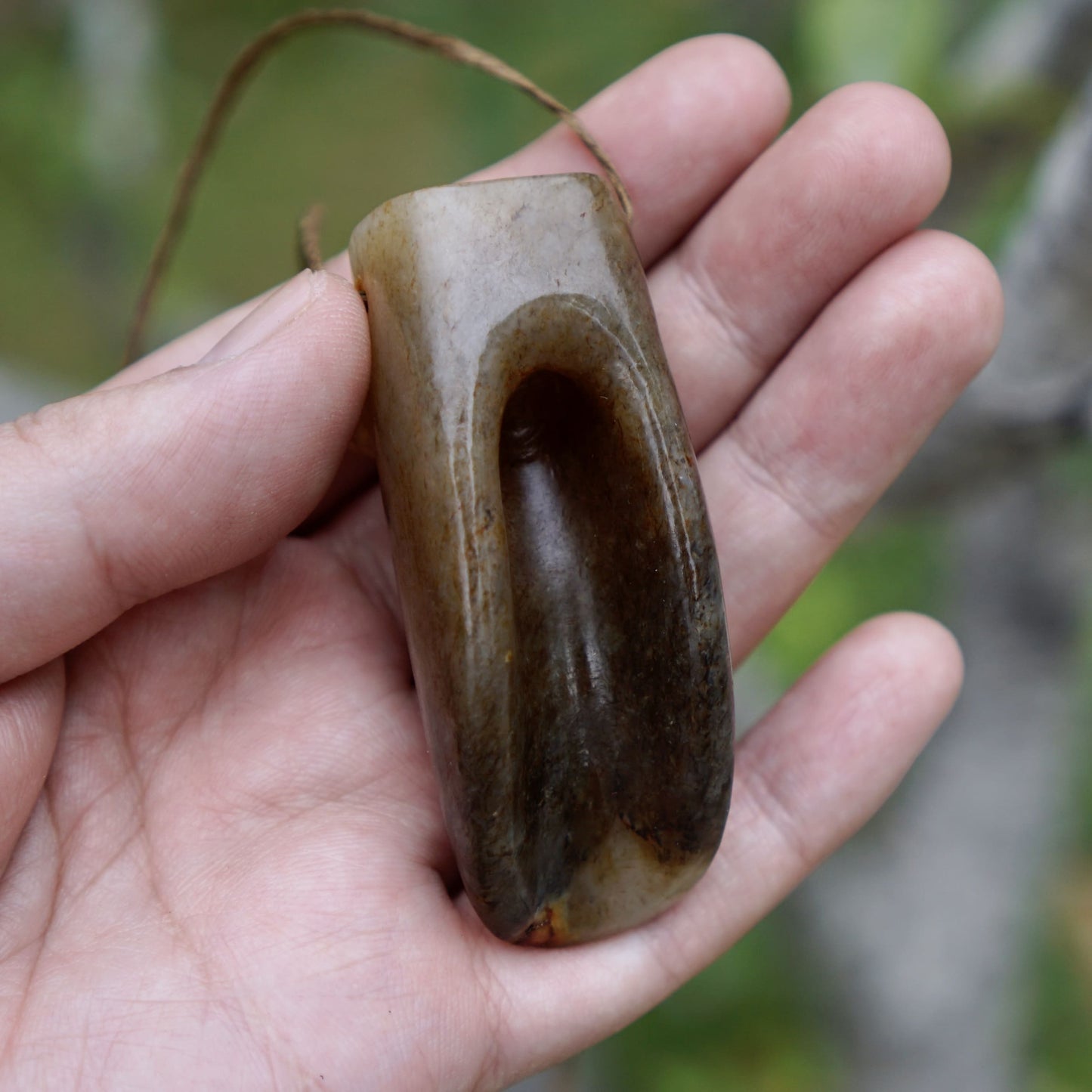 Tubular round sculpture of a jade cicada with convex eyes