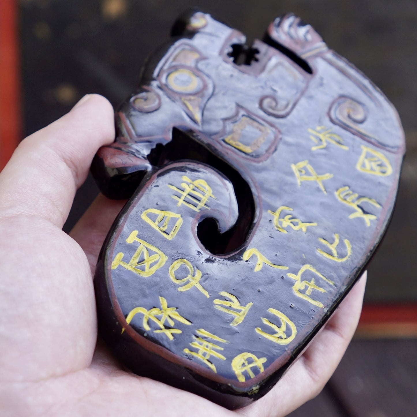 A double-sided lacquer-painted jade tiger with inscriptions