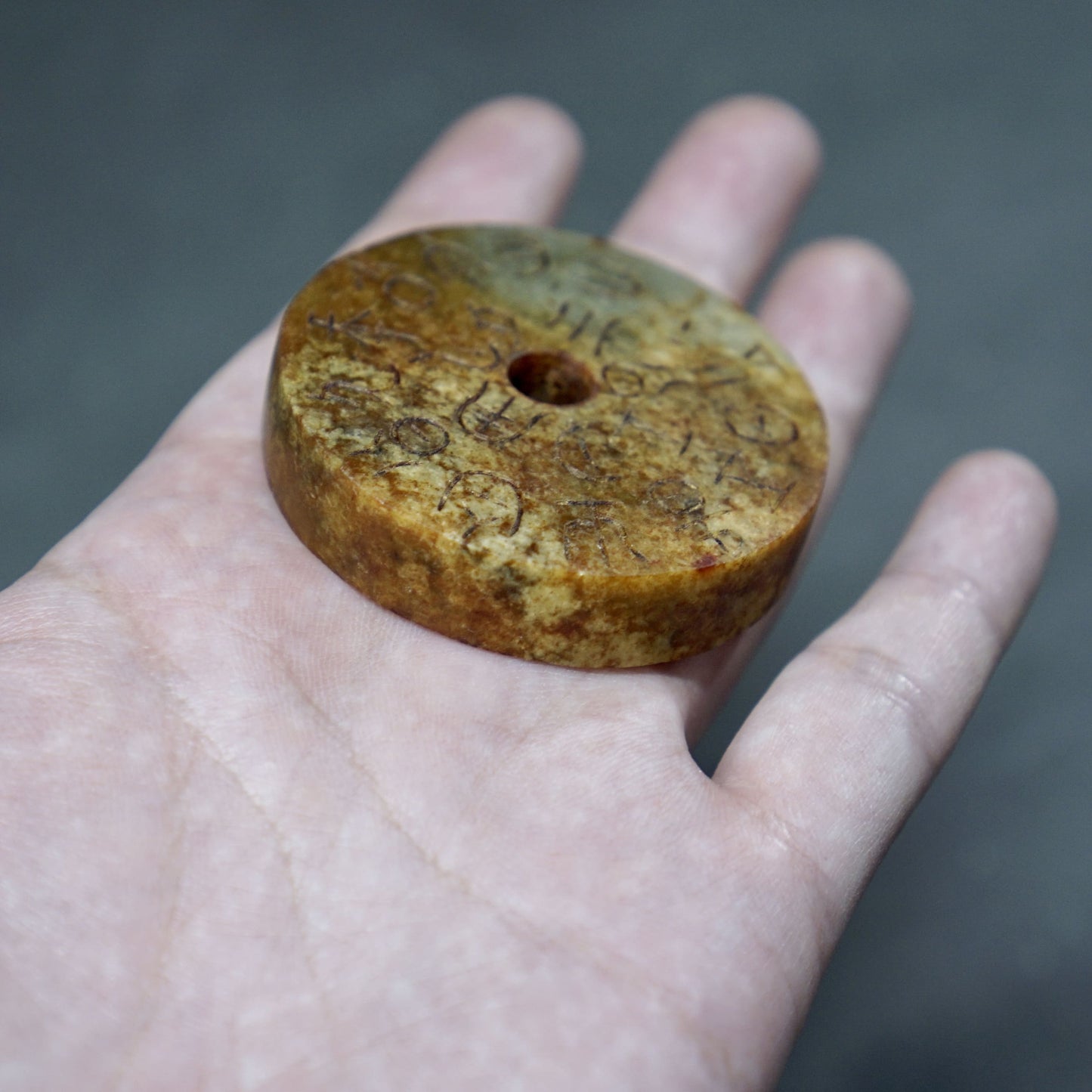 Double-sided jade bi with inscriptions and seal carvings