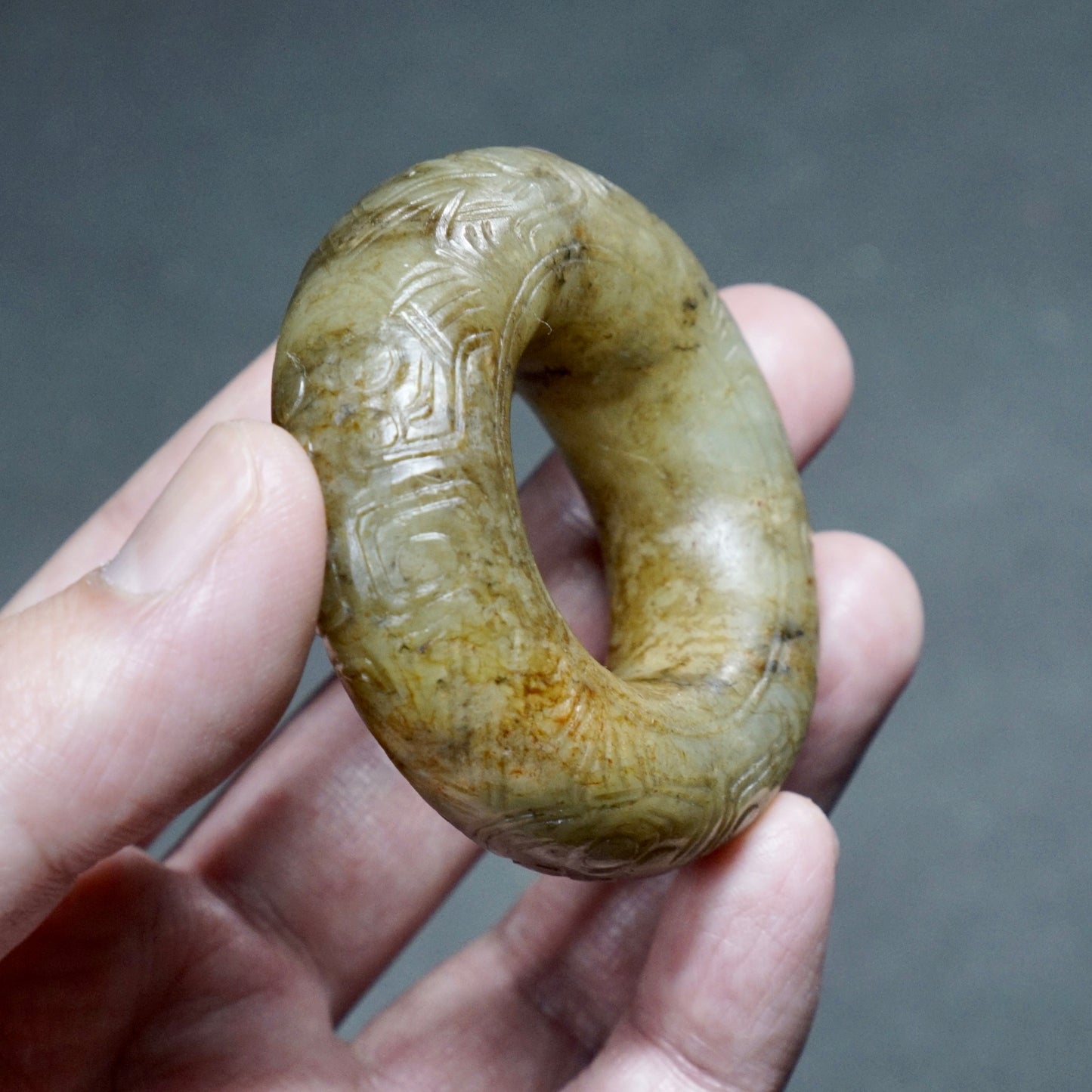 Jade ring with human face pattern